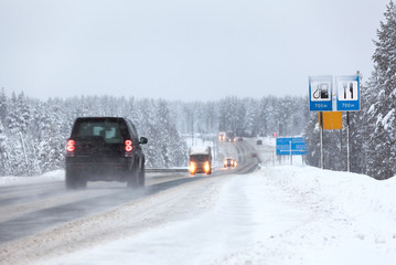 Vehicles driving on the Kola highway in winter season