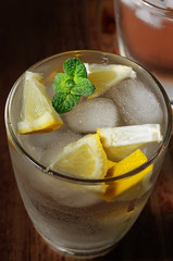 Cold fresh lemonade on the woden table