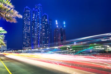 Muurstickers Traffic lights on the street of Abu Dhabi at night, UAE © Patryk Kosmider