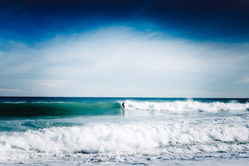 Surfer on a big wave - 80633581