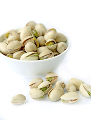 Many pistachio on white background