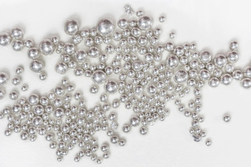 Pure silver granules on a white background