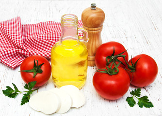 olive oil, mozzarella cheese,  garlic and tomatoes