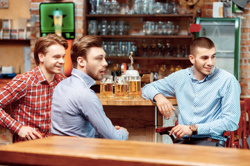 Friends have a beer at the pub
