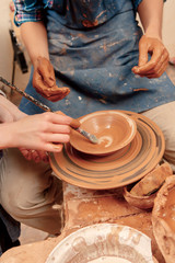 Sculpturing the clay pot