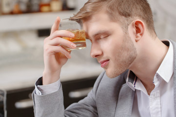Man with a cocktail in the bar