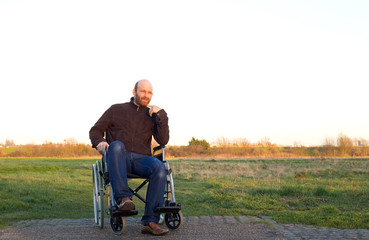 man in a wheelchair reflecting upon life.