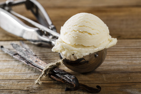 ball of vanilla ice cream in a spoon scoop