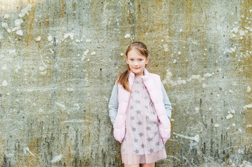 Outdoor portrait of adorable little girl of 7 years old