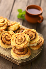 Homemade cinnamon rolls on wooden board