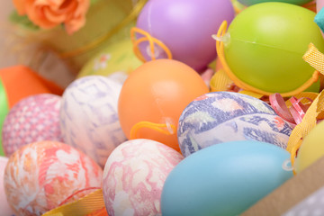 Fototapeta na wymiar Easter background with eggs, ribbons and spring decoration