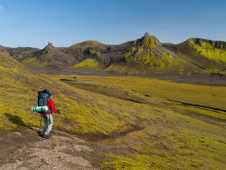 Hiker with trekking poles on Laugavegurinn