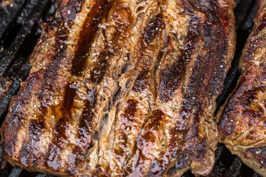 Beef steaks on grill or BBQ