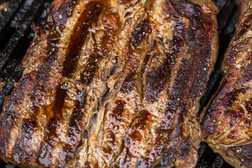 Obraz na płótnie Canvas Beef steaks on grill or BBQ