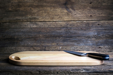 cutting board with cutter on a wooden table
