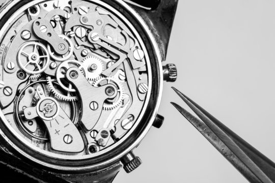 Vintage watch movement repair and tweezers