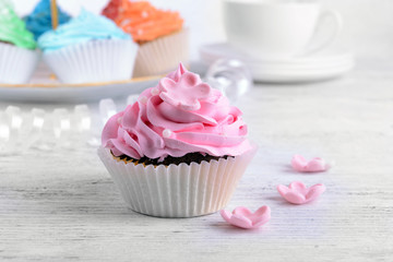 Delicious cupcakes on table close-up