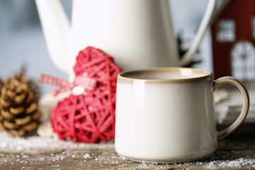Winter composition with hot beverage on nature background