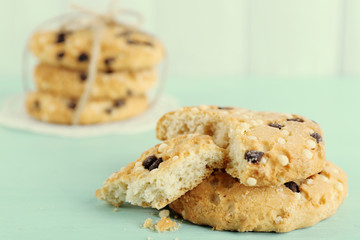 Tasty cookies on color wooden background