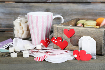 Heart shaped teabag tags, macaroons and cup of tea