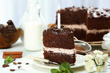 Delicious chocolate cake on table on light background