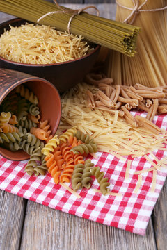 Different types of pasta on napkin close up