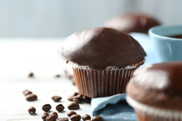 Tasty homemade chocolate muffins and cup of coffee