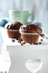 Tasty homemade chocolate muffins and cup of coffee