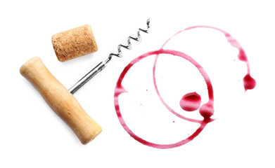 Wine stains, cork and corkscrew  isolated on white