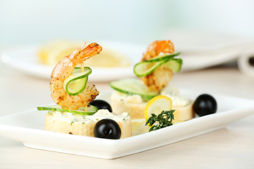 Appetizer canape with shrimp and olives