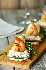 Appetizer canape with shrimp and cucumber