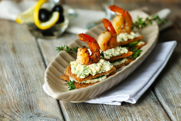 Appetizer canape with shrimp and cucumber