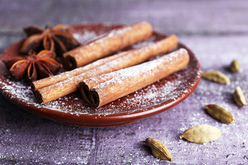 Spices in plate with powdered sugar