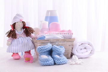 Fototapeta na wymiar Baby accessories on table on light background