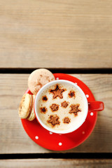 Cup of coffee  and macaroons on old wooden table
