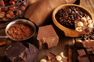 Still life with set of chocolate on wooden table, closeup