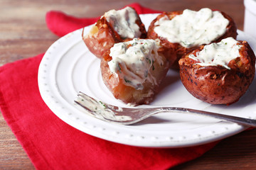 Baked potatoes with mushrooms and sauce