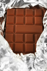 Bar of chocolate in foil, closeup