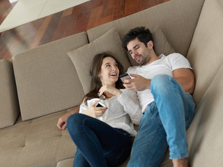 young couple making selfie together at home