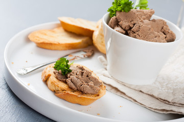 Chicken liver pate on bread and in bawl