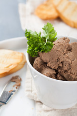 Healthy chicken liver pate with parsley in bawl