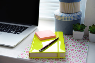 Laptop, notebook on windowsill. Working place concept