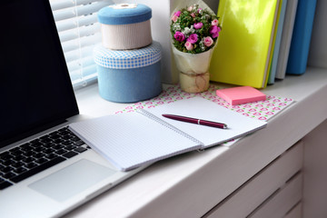 Laptop, notebook on windowsill. Working place concept