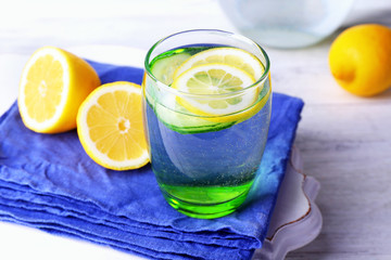 Fresh water with lemon and cucumber in glassware