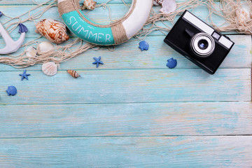 Beach accessories on wooden background