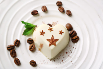 Tasty panna cotta dessert on plate, close up