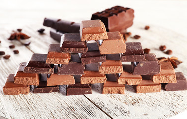 Pyramid of squared chocolate on wooden table