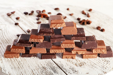 Pyramid of squared chocolate on wooden table
