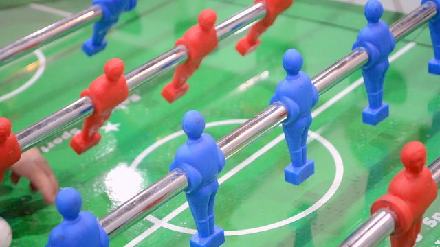 active soccer (football) game, abstract toy football game closeup,  children's desktop table soccer, sport field area, modern entertainment hobby diversity
