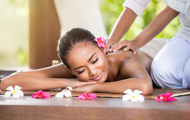 Obraz na płótnie Canvas Smiling woman enjoying a massage
